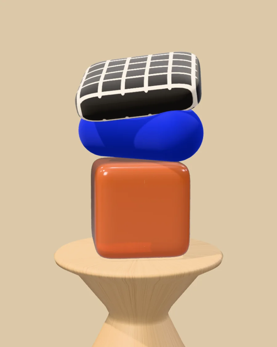 Un piédestal en bois tourné, avec un bloc de résine terracotta, un traversin de velours bleu Klein et un coussin à grille noir et blanc empilés dessus
